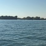 This mild picture is hiding some drama. This is the Lake Erie Metropark Marina in Michigan. I called earlier in the day and the very nice woman I spoke with assured me that my 5'10" draft would "probably be fine" if I stayed in the channel. My engine was overheating due to a partially blocked water intake but I was close to being done for the day as I entered this channel. Before I even made it to the marina, I softly ran aground in what felt like mud. I was able to back out of the mud and head back out into the lake.