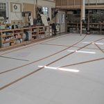 The lofting floor where he’s transferring the shapes from the plan to real size so he can make patterns for the frames.