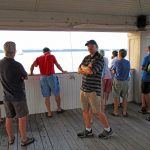 That evening, the Erie Yacht club held their regular Wednesday night races. It’s a unique course because the fleet can race completely inside Erie Harbor and the races are easily watched from shore. This is most of our fleet watching their fleet from the club's pavilion. It was great fun.