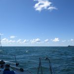 As I was nearing Ashtabula, I was on an intercept for the bulk carrier Cuyahoga. I could have rushed and got in the harbor before him without getting in his way but I hailed him and told him that I’d drop my sails and let him pass.